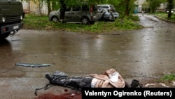 A body lies at the site of a Russian missile strike on Chernihiv, Ukraine, on April 17.