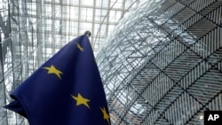 Belgium - The European Union flag inside the atrium during an EU summit at the European Council building in Brussels, Monday, June 17, 2024.