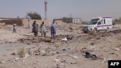 Pakistani security officials examine the site of a deadly bomb attack targeting a procession in Balochistan on September 29. 