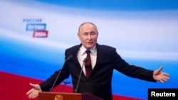 RUSSIA - Russian presidential candidate and incumbent President Vladimir Putin speaks after polling stations closed, Moscow, March 18, 2024. 