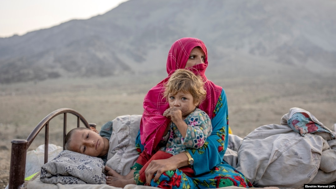 Afghan refugees settle in a camp near the Pakistan-Afghanistan border in Torkham, Afghanistan, after fleeing Pakistan on November 4.
