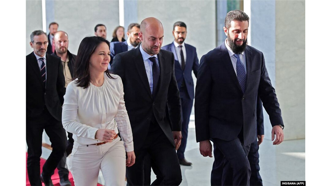 French Foreign Minister Jean-Noel Barrot and Germany's Annalena Baerbock walk with Sharaa ahead of their meeting in Damascus on January 3.