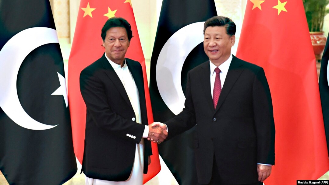 Chinese President Xi Jinping (right) shakes hands with Pakistani Prime Minister Imran Khan before a meeting in Beijing in April 2019.