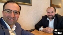 Armenia - Health Minister Arsen Torosian (L) takes a selfie with Environment Minister Erik Grigorian at a smoke-free restaurant in Yerevan, February 7, 2019.