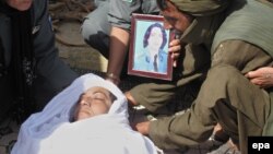 Relatives and colleagues at the funeral of Lieutenant Nigar, who was died following an attack by armed gunman.