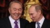 Russia - Russian President Vladimir Putin (R) speaks with Kazakhstan's President Nursultan Nazarbayev (L) during sign documents ceremony before opening of the Supreme Eurasian Economic Council in Moscow, 24 December 2013