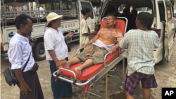 Rescue workers in the Myanmar capital, Naypyitaw, attend to an injured man who was trapped under a building following an earthquake on March 28.