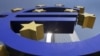 Germany -- The sun is reflected on the facade of the European Central Bank ECB Tower, seen through the Euro symbol, in Frankfurt, 06Aug2009