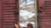 Armenia -- A worker opens a rail car laden with imported grain seeds, 1Oct 2010.