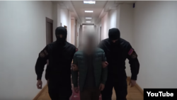 Armenia -- A screenshot of video that shows National Security Service officers arresting a man who admitted falsely claiming that Prime Minister Nikol Pashinian hailed the killing of Iranian General Qassem Soleimani, January 5, 2020.
