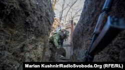 A Ukrainian soldier digs a trench near Horlivka in the Donetsk region.