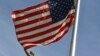 KOSOVO -- The US flag flies at half-mast next to the statue of former U.S. President Bill Clinton in Pristina, September 11, 2017