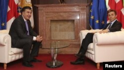Президент Грузии Михаил Саакашвили и премьер-министр Бидзина Иванишвили на встрече в Тбилиси, 4 марта 2013 года.