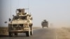 SYRIA -- U.S. armored vehicles patrol in the countryside of the eastern Syrian Deir Ezzor province, January 31, 2019