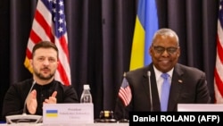 Ukrainian President Volodymyr Zelensky (left) and U.S. Defense Secretary Lloyd Austin attend the opening of the Ukraine Defense Contact Group meeting at Germany's Ramstein Air Base on January 9.