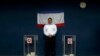 Чиновник стоит между двумя урнами для голосования во время проведенного Россией «референдума» в Крыму. Бахчисарай, 16 марта 2014 года