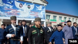 Chechnya -- Chechen leader Ramzan Kadyrov (C) leaves a polling station in the village of Tsentaroi during Russian parliament elections, September 18, 2016