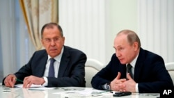 Russian President Vladimir Putin (right) and Foreign Minister Sergei Lavrov (file photo)