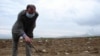 Armenia -- Journalist EdiK Baghdasaryan investigates the chemical waste disposal site in Nubarashen, Yerevan, undated