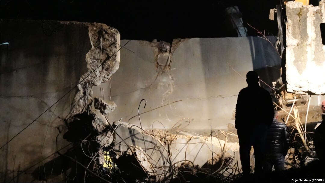 Officials inspect the damaged section of the canal in Varrage village, in the Zubin Potok municipality, after the November 29 explosion.