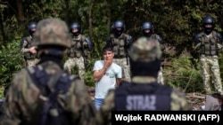 Архіўнае ілюстрацыйнае фота. Мігранты на беларуска-польскай мяжы, жнівень 2021 году