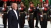 Afghan President Ashraf Ghani inspects the honor guard during Independence Day celebrations at Defense Ministry in Kabul on August 19.
