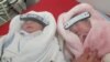 Kosovo: Babies with masks 
