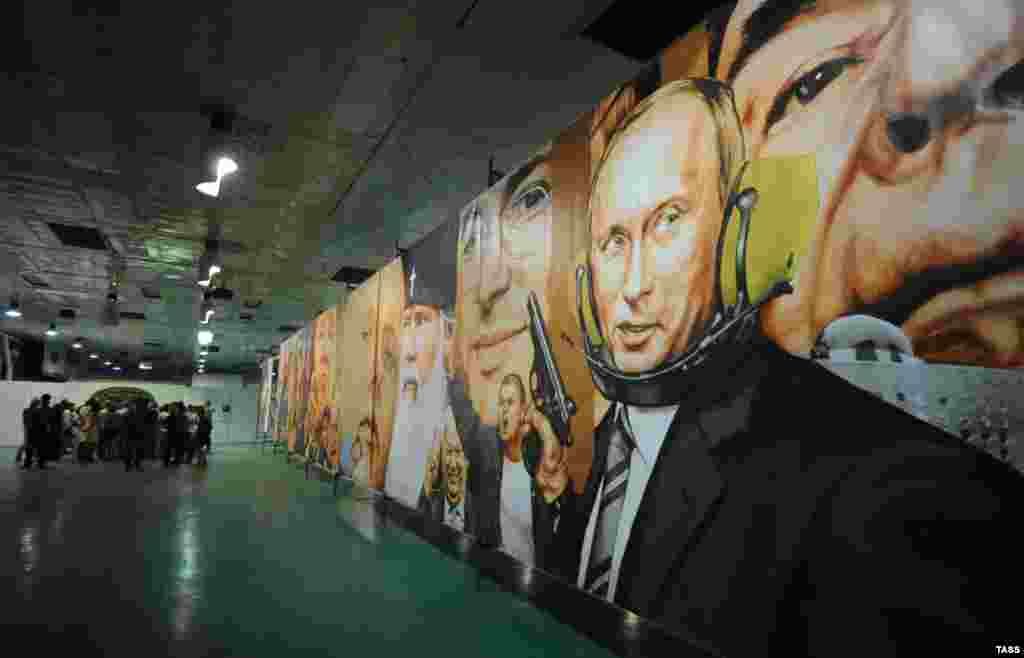 A painting on display during an exhibition titled "Rodina" in Novosibirsk