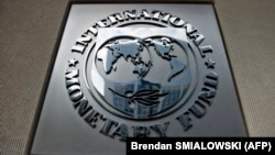 U.S. -- A logo outside the headquarters of the International Monetary Fund in Washington, DC, June 30, 2015.
