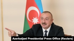 AZERBAIJAN -- Azerbaijani President Ilham Aliyev gestures as he speaks during an address to the nation in Baku, October 26, 2020