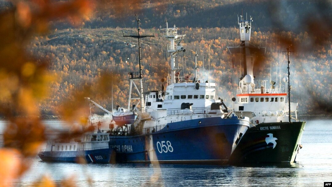 Greenpeace's "Arctic Sunrise"(right) is moored next to a Russian Coast Guard ship in the northern port of Murmansk.